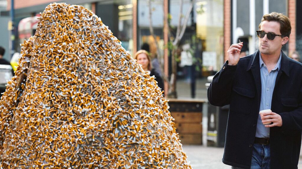 Stunned public come face to face with 6ft high mountain of 225,000 cigarette stubs in busy city centre in new art exhibition | Daily Mail Online