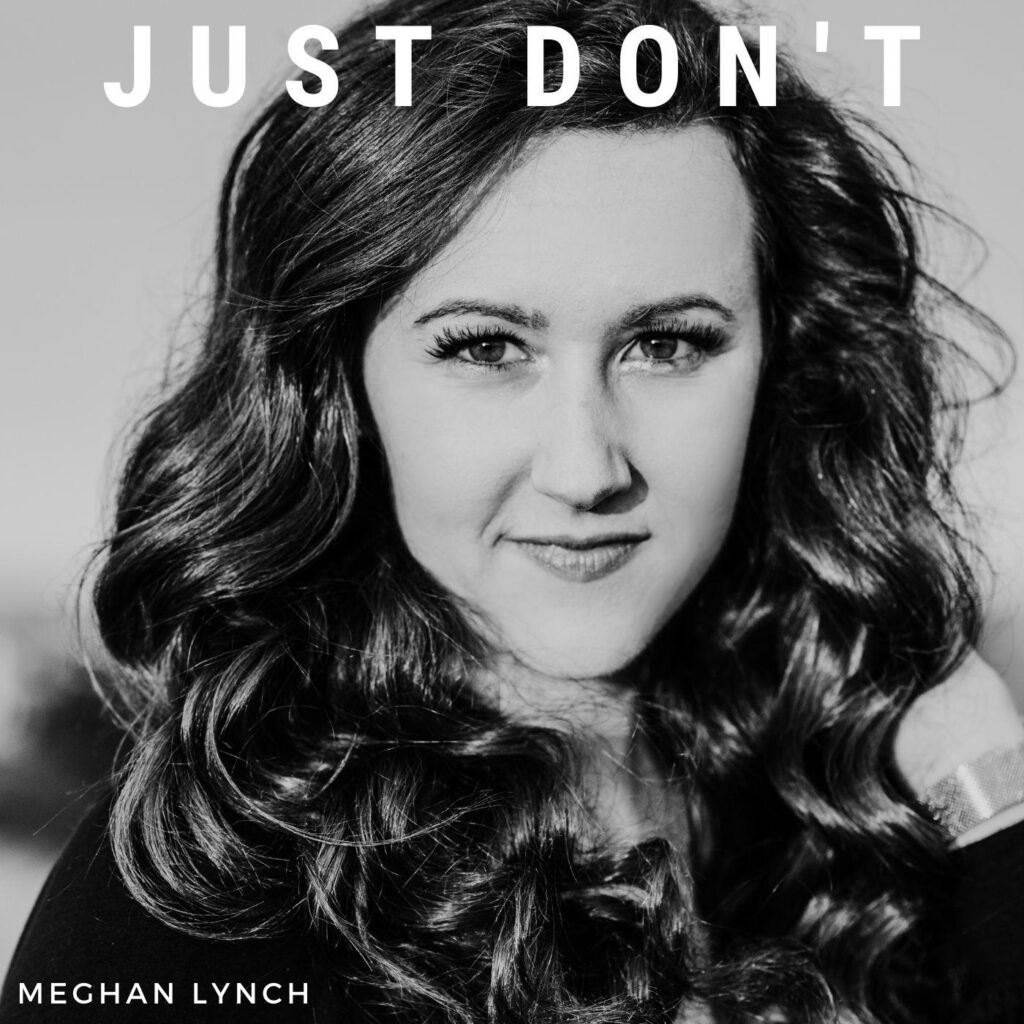 Black and white close-up portrait of a woman with long, wavy hair. Meghan Lynch gazes directly at the camera with a slight smile. The text "JUST DON'T" hovers above, while her name is elegantly inscribed at the bottom against a softly blurred background.