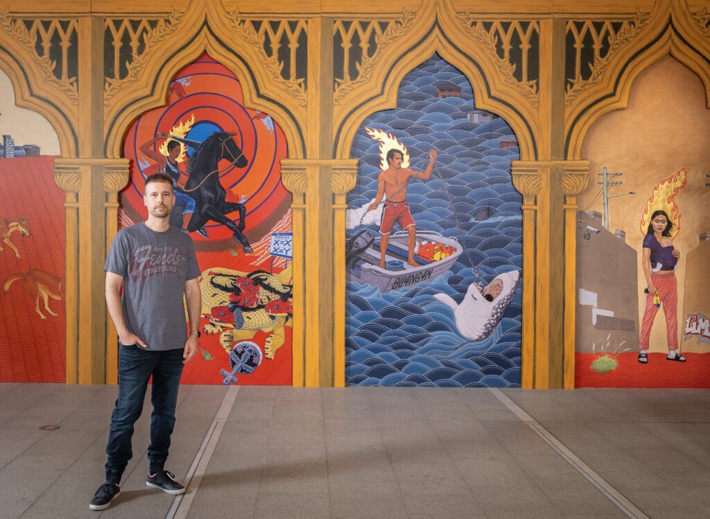 Marri Ngarr artist Ryan Presley in front of Paradise won at the National Portrait Gallery in 2024.