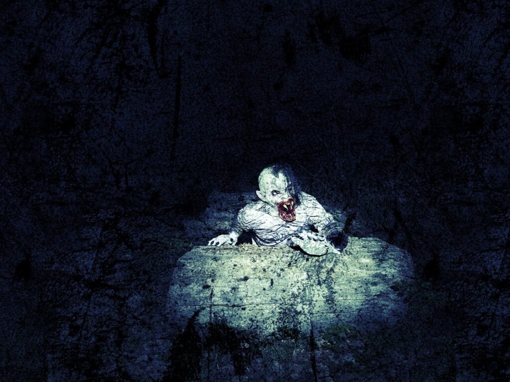 A pale, frightening zombie with glowing eyes and a bloody mouth emerges from a cracked, dirty floor in a dark, shadowy environment. Its tattered clothes and decayed skin create a nightmarish, horror scene, highlighted by a dim spotlight.
