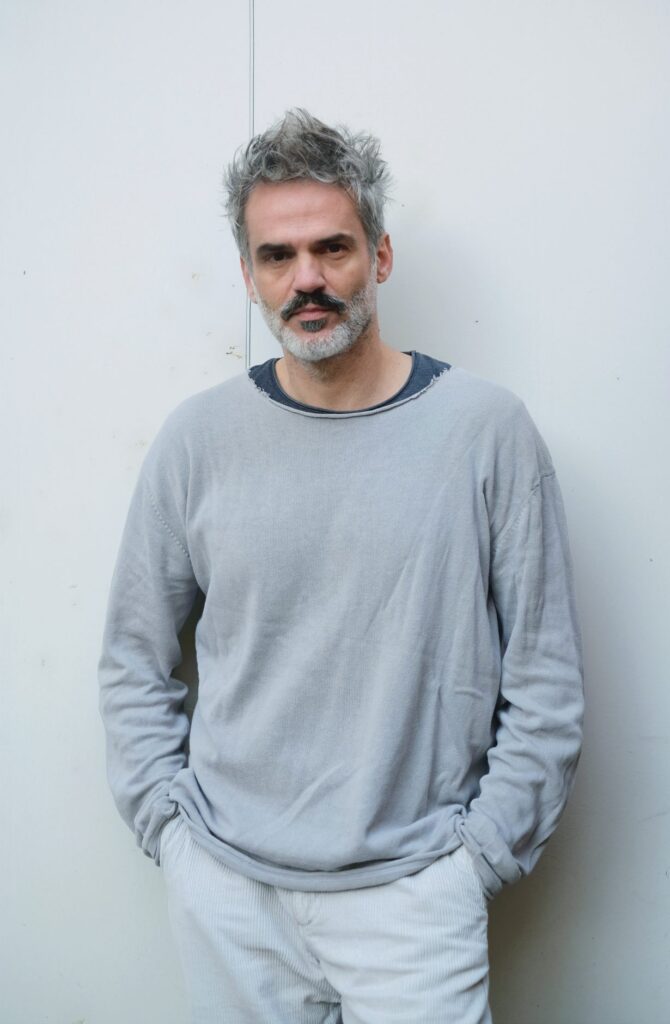 Portrait of Albanian visual artist Genti Korini.