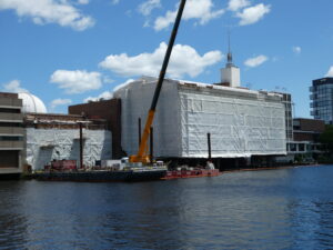 Museum of Science in Boston wrapped for renovation beside a crane in June 2025